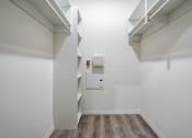 Thumbnail 28 of 42 - Walk in closet with wood style flooring