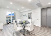 Thumbnail 26 of 42 - Dining area with recessed lighting, living room in the left, wood inspired flooring throughout