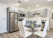 Thumbnail 20 of 42 - Dining area with wood style flooring, open Gourmet Kitchen, recessed lighting