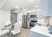 Thumbnail 7 of 42 - Kitchen with Built-in stainless-steel refrigerator, stove, microwave, and dishwasher, Quartz Countertops