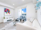 Thumbnail 19 of 42 - Living room with Private Balcony in the right, wood style flooring, recessed lighting