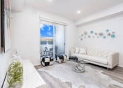 Thumbnail 12 of 42 - Spacious Living room with Private Balcony or Patio, Sliding door, recessed lighting, wood style flooring