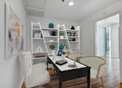 Thumbnail 18 of 28 - a home office with white walls and a black desk