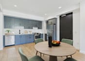 Thumbnail 16 of 157 - A modern kitchen with a dining table and chairs.