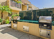 Thumbnail 33 of 40 - A wall with a grill and a fridge on it.