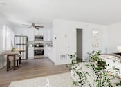 Thumbnail 24 of 81 - A kitchen with a dining table and chairs.