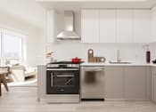 Thumbnail 10 of 163 - A modern kitchen with a black oven and a stove top.