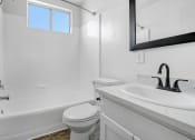 Thumbnail 92 of 95 - a bathroom with a sink toilet and a bath tub
