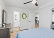 Thumbnail 27 of 66 - a bedroom with a large bed and a ceiling fan