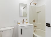 Thumbnail 30 of 66 - a bathroom with a sink and a toilet and a shower