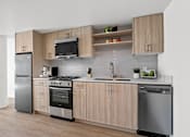 Thumbnail 32 of 54 - A modern kitchen with wooden cabinets and stainless steel appliances.