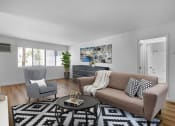 Thumbnail 5 of 19 - a living room with a couch and two chairs