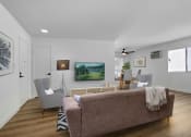 Thumbnail 4 of 19 - a living room with a couch and chairs