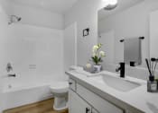 Thumbnail 8 of 19 - a bathroom with a sink toilet and bathtub