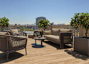 Thumbnail 5 of 25 - Rooftop deck with seating and sweeping Downtown skyline views