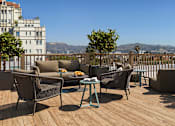 Thumbnail 4 of 25 - Rooftop deck with lounge seating and panoramic Hollywood hillside views