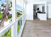 Thumbnail 8 of 251 - A balcony with a view of a garden and trees.