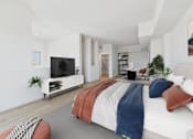Thumbnail 32 of 52 - A modern bedroom with a large bed and a television.