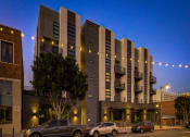 Thumbnail 13 of 31 - the building where the hotel is located is lit up at night