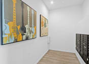 Thumbnail 12 of 31 - ertainment room with two paintings on the wall and a filing cabinet