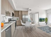 Thumbnail 11 of 31 - a kitchen and dining area in a 555 waverly unit
