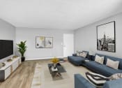 Thumbnail 3 of 10 - a living room with blue couches and a tv