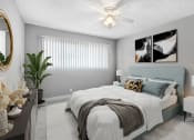 Thumbnail 7 of 10 - a bedroom with a bed and a ceiling fan