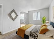 Thumbnail 4 of 11 - a bedroom with a bed and a sliding glass door
