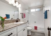 Thumbnail 5 of 10 - a bathroom with a sink and a toilet