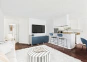 Thumbnail 12 of 82 - A living room with a white sofa, a television, and a bar area.
