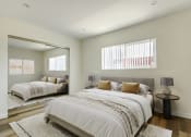 Thumbnail 6 of 76 - a bedroom with two beds and a large mirror