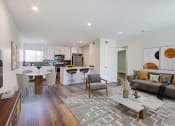 Thumbnail 2 of 76 - a living room with a kitchen and a dining room