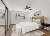 Thumbnail 61 of 135 - a bedroom with a bed and a ceiling fan