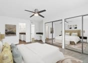 Thumbnail 51 of 135 - a bedroom with a large bed and a ceiling fan