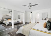 Thumbnail 66 of 135 - a bedroom with a bed and a ceiling fan
