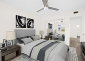 Thumbnail 72 of 135 - a bedroom with a bed and a ceiling fan