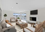 Thumbnail 67 of 135 - a living room with a fireplace and a large window
