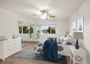 Thumbnail 45 of 135 - a bedroom with a bed and a ceiling fan