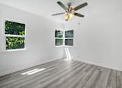 Thumbnail 15 of 20 - an empty room with white walls and a ceiling fan