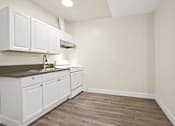 Thumbnail 26 of 38 - the preserve at ballantyne commons apartment kitchen with white cabinets