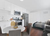 Thumbnail 11 of 25 - a kitchen and dining area in a 555 waverly unit