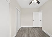 Thumbnail 32 of 38 - an empty room with white walls and a ceiling fan
