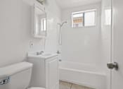 Thumbnail 10 of 38 - a bathroom with a sink toilet and a shower