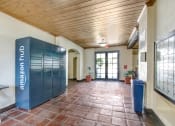 Thumbnail 13 of 16 - a room with a lockers and a bench