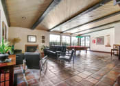 Thumbnail 15 of 16 - a large living room with a pool table in the corner