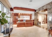 Thumbnail 22 of 95 - a lobby with a reception desk and a large window