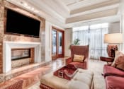 Thumbnail 25 of 95 - a living room with a couch and a fireplace