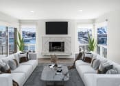 Thumbnail 23 of 135 - a living room with white couches and a fireplace