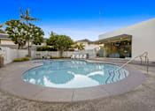 Thumbnail 178 of 208 - A round above ground pool with a metal railing around it.