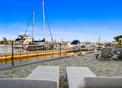 Thumbnail 182 of 208 - A serene beachside setting with a clear blue sky and a calm sea.